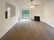 Spacious living room with a cozy fireplace and sliding glass door leading to the backyard at 2424 Turtle Xing Ne, Marietta, GA 30066