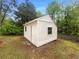 White storage shed in backyard at 2424 Turtle Xing Ne, Marietta, GA 30066