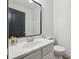 Powder room features a modern mirror and vanity at 3465 Caney Creek Ln, Cumming, GA 30041
