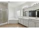 Bathroom showcasing a luxurious soaking tub, and double sink vanity at 3465 Caney Creek Ln, Cumming, GA 30041