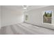Sunlit bedroom features neutral walls, plush carpeting, and large windows at 3465 Caney Creek Ln, Cumming, GA 30041