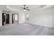 Large and well-lit bedroom featuring ample space, neutral walls, and a fan at 3465 Caney Creek Ln, Cumming, GA 30041