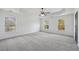 Spacious bedroom with abundant natural light and a ceiling fan at 3465 Caney Creek Ln, Cumming, GA 30041
