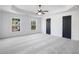 Bright and spacious bedroom featuring a trey ceiling, fan and two large closets at 3465 Caney Creek Ln, Cumming, GA 30041