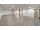 A large unfinished basement has white walls, a gray floor, and metal support beams at 3775 Belle Glade Trl, Snellville, GA 30039