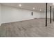 An unfinished basement area has completed walls, floors, and a painted ceiling at 3775 Belle Glade Trl, Snellville, GA 30039
