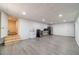 Finished basement featuring gray wood-look flooring, mini kitchen, and access to a bathroom adds living space at 3775 Belle Glade Trl, Snellville, GA 30039