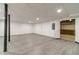 Unfinished basement with gray floors and bright recessed lighting at 3775 Belle Glade Trl, Snellville, GA 30039