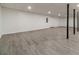 Unfinished basement with finished ceiling and gray flooring at 3775 Belle Glade Trl, Snellville, GA 30039