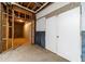 Unfinished basement with exposed framing, concrete floors, and a storage area offers customization potential at 3775 Belle Glade Trl, Snellville, GA 30039