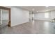 Finished basement with gray floors, natural light, and neutral walls is suited for living and recreation at 3775 Belle Glade Trl, Snellville, GA 30039