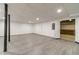 This unfinished basement has white walls, updated flooring, and metal support beams at 3775 Belle Glade Trl, Snellville, GA 30039