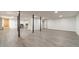This basement area contains updated floors, white walls, and is ready to be furnished at 3775 Belle Glade Trl, Snellville, GA 30039