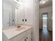 Clean and tidy bathroom with white fixtures, bright lighting, and updated vanity at 3775 Belle Glade Trl, Snellville, GA 30039
