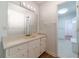 Well-lit bathroom featuring a classic vanity with ample cabinet space and neutral tile at 3775 Belle Glade Trl, Snellville, GA 30039