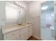 Bright bathroom with an extended vanity, plenty of storage, and a doorway leading to the other bathroom at 3775 Belle Glade Trl, Snellville, GA 30039