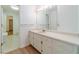 Bathroom features an elegant vanity with good lighting and a glimpse of the toilet at 3775 Belle Glade Trl, Snellville, GA 30039