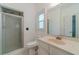 Clean bathroom with glass-enclosed shower, neutral color scheme, and good natural light at 3775 Belle Glade Trl, Snellville, GA 30039