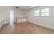 Upstairs landing featuring hardwood floors, railing, and a view of the bedroom at 3775 Belle Glade Trl, Snellville, GA 30039