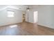 Well lit bedroom with wood floors, neutral walls, windows, and doorways with access to the hallway at 3775 Belle Glade Trl, Snellville, GA 30039