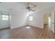Bright and airy bedroom with wood laminate flooring, ceiling fan, and sunlit windows at 3775 Belle Glade Trl, Snellville, GA 30039