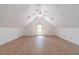 Wide angle of an attic bonus room featuring a ceiling fan and a window at 3775 Belle Glade Trl, Snellville, GA 30039