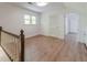 A bright bonus room features a window, wooden floors, and a door to an adjacent room at 3775 Belle Glade Trl, Snellville, GA 30039