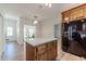 Spacious kitchen features wood cabinets, stainless refrigerator, and island at 3775 Belle Glade Trl, Snellville, GA 30039