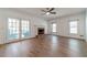 Spacious living room features a brick fireplace, hardwood floors, and access to an outdoor space at 3775 Belle Glade Trl, Snellville, GA 30039