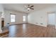 Large open living space with fireplace, hardwood floors, natural light, and neutral color palette at 3775 Belle Glade Trl, Snellville, GA 30039