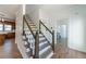Beautiful staircase with decorative wood railing leads to the upper level of the home, adding architectural interest at 3775 Belle Glade Trl, Snellville, GA 30039