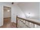 Bright stairwell landing featuring wood floors, chandelier, and staircase with white spindles at 3775 Belle Glade Trl, Snellville, GA 30039