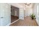 Sunroom with french doors, new flooring, and a ceiling fan, offering bright natural light at 3775 Belle Glade Trl, Snellville, GA 30039