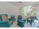 Relaxing sunroom filled with natural light offering cozy seating and a tranquil atmosphere at 3775 Belle Glade Trl, Snellville, GA 30039