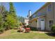 Backyard featuring an outdoor seating area, a fire pit, and mature trees at 5075 Chase Ln, Cumming, GA 30040