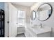 Bright bathroom with double vanity, vessel sinks, and modern mirrors at 5075 Chase Ln, Cumming, GA 30040