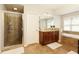 Bathroom featuring a glass shower, soaking tub, and modern fixtures at 5075 Chase Ln, Cumming, GA 30040