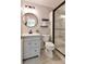 Modern bathroom features glass enclosed shower and updated vanity at 5075 Chase Ln, Cumming, GA 30040