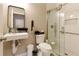 Bathroom with a walk-in shower, floating sink, and modern fixtures at 5075 Chase Ln, Cumming, GA 30040