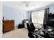 Bedroom with a desk, wooden dresser and neutral colors at 5075 Chase Ln, Cumming, GA 30040