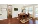 Dining room features natural light, hardwood floors, and access to another room at 5075 Chase Ln, Cumming, GA 30040