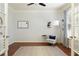 Bright home office with French doors, hardwood floors and stylish decor for a productive and inviting workspace at 5075 Chase Ln, Cumming, GA 30040