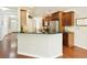 Kitchen with stainless steel appliances, dark cabinetry and granite countertops at 5075 Chase Ln, Cumming, GA 30040