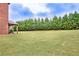 Manicured backyard with lush lawn and green trees, ideal for outdoor activities at 609 Eskimo Ct, Cts, Hampton, GA 30228