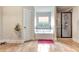 Bathroom with tile floor, soaking tub, and glass shower at 609 Eskimo Ct, Cts, Hampton, GA 30228