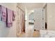 Bathroom view showing decorative shower curtain and doorway leading into bedroom at 609 Eskimo Ct, Cts, Hampton, GA 30228