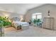 Large bedroom with neutral colors, and vaulted ceilings at 609 Eskimo Ct, Cts, Hampton, GA 30228