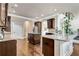 Well-equipped kitchen with granite countertops, dark wood cabinets, and hardwood flooring, perfect for cooking at 609 Eskimo Ct, Cts, Hampton, GA 30228