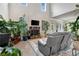 Bright living room featuring vaulted ceiling, fireplace, and comfortable seating ideal for relaxation at 609 Eskimo Ct, Cts, Hampton, GA 30228