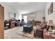 Living room with an office space, built-in bookshelves, and neutral walls at 609 Eskimo Ct, Cts, Hampton, GA 30228